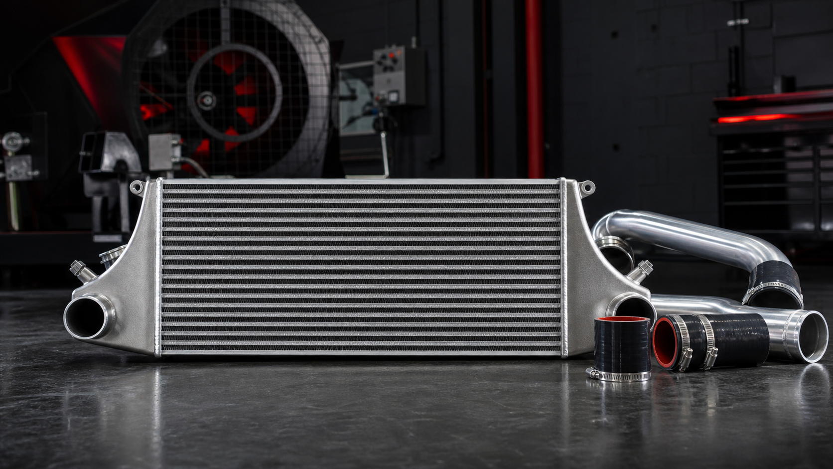 Front-mount intercooler with aluminum charge pipes and silicone couplers
