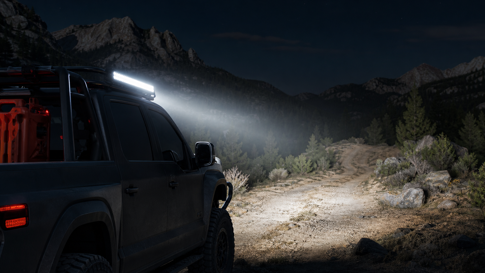 LED light bar mounted on an off-road pickup illuminating an empty trail at night