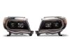 Raxiom 05-11 Toyota Tacoma Axial Series Switchback Projector Headlights- Black Housing- Clear Lens