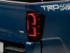 Raxiom 16-23 Toyota Tacoma LED Tail Lights- Black Housing (Smoked Lens)