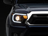 Raxiom 12-15 Toyota Tacoma Axial Series Projector Headlights w/ LED Bar- Black Housing (Clear Lens)