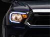 Raxiom 12-15 Toyota Tacoma Axial Series Headlights/Seq LED Bar- Black- Clear Lens