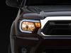 Raxiom 12-15 Toyota Tacoma Axial Series Headlights w/ LED Bar- Black Housing (Clear Lens)