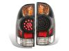 Raxiom 05-06 Toyota Tacoma LED Tail Lights- Black Housing- Red/Clear Lens