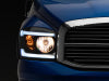 Raxiom 06-09 Dodge RAM 1500/2500/3500 Axial Headlights w/ SEQL LED Bar- Black Housing (Clear Lens)
