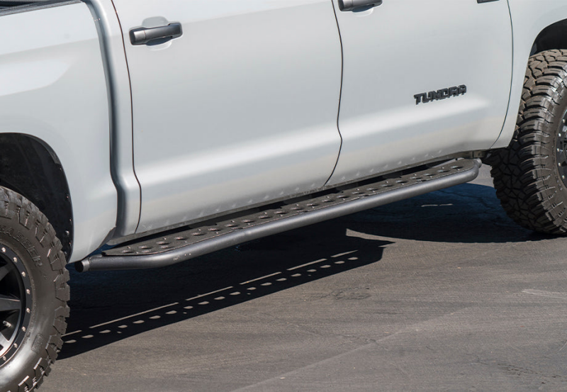 Cali Raised 14-21 Toyota Tundra Step Ed Rock Sliders - Kick Out/PwdrCoat Plate/BedLiner