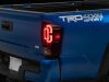 Raxiom 16-23 Toyota Tacoma XW Series Sequential LED Tail Lights- Black Housing- Red Lens