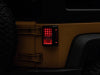 Raxiom 07-18 Jeep Wrangler JK Axial Series Lux LED Tail Lights- Black Housing (Clear Lens)
