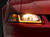 Raxiom 99-04 Ford Mustang Axial Series Headlights w/ Sequential LED Bar- Black Housing (Clear Lens)